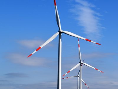 white and red 3-blade windmills during daytime